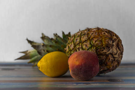 Exotic color fresh fruit on old blue table with side day lightの写真素材