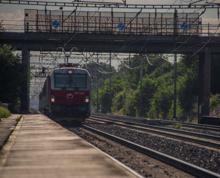 Trains on main Czech railway Prague Kolin in summer hot sunny evening
