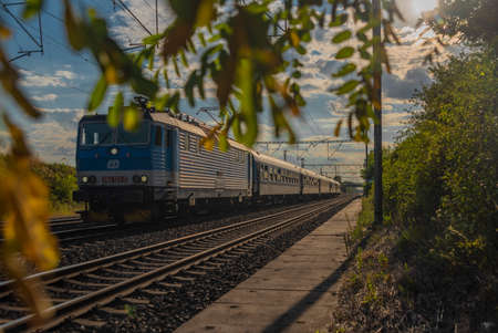 Trains on main Czech railway Prague Kolin in summer hot sunny evening