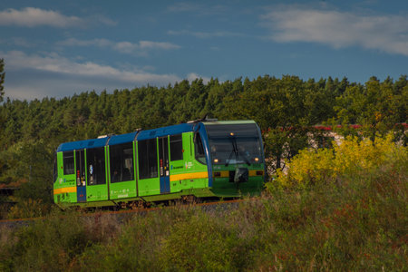 Green train of private company in summer sunny evening near Rakovnik townのeditorial素材