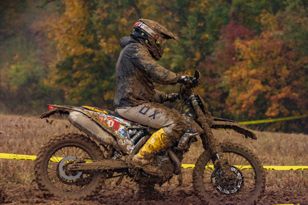 Dirty championship in cloudy sludge autumn day on motorbike near Vysoke nad Jizerou townのeditorial素材