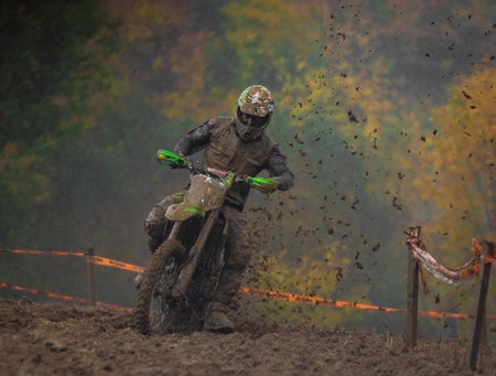 Dirty championship in cloudy sludge autumn day on motorbike near Vysoke nad Jizerou townのeditorial素材