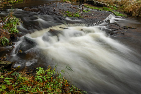 Loucka river near Tisnov town in autumn cloudy dark wet day