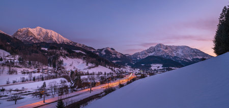 Winter evening over Spital am Pyhrn in Austria with railway small stationの写真素材