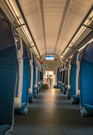 Interior of modern electric train in Slovenia with blue comfortable clean seats