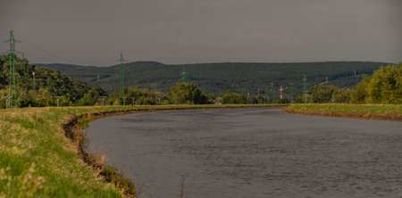 Biskupicky canal near Vah river in summer hot afternoon after storm in Kostolna big village