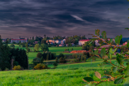 Summer view between green fields near Vysoke nad Jizerou town in nice eveningの写真素材