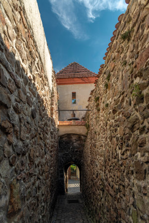 The most slimmest historic street in the Czech Republic in sunny day in Kadanの写真素材