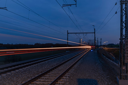 Color lines from train in stop Cerveny Ujezd in color cloudy winter evening
