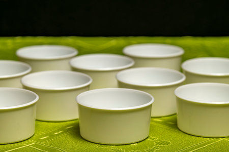 Making of marijuana healthy salve with black background and red cooking pot
