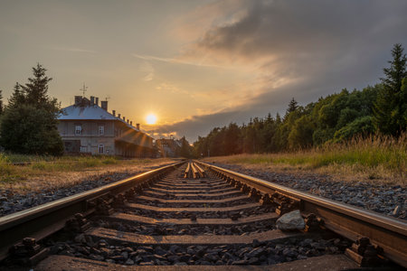 Railway tracks in summer hot evening in Moldava station in Krusny hory