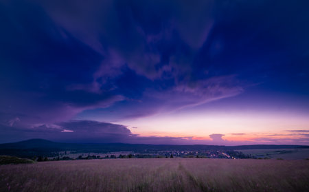 Sunset near Bozi Dar town in summer hot evening with cloudy sky before stormの写真素材