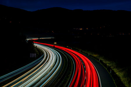 Night on highway and car lines with pedestrian bridge Cat eyes near Chlumec north Bohemia townの写真素材