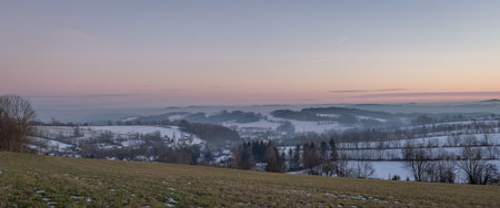 Winter frosty view after sunset in Roprachtice village in Krkonose mountainsの写真素材