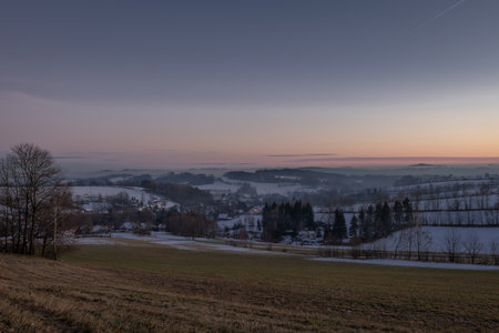 Winter frosty view after sunset in Roprachtice village in Krkonose mountainsの写真素材