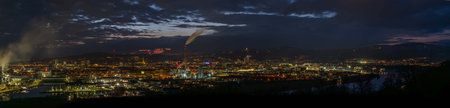 Night evening winter view from hill for city and factories in Linz Austria 02 28 2025の写真素材