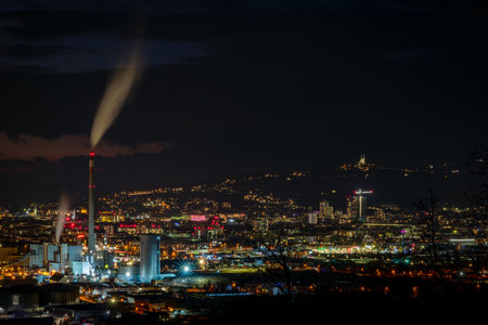 Night evening winter view from hill for city and factories in Linz Austria 02 28 2025の写真素材