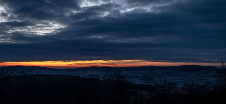 Orange sunrise with blue hour colors monastery near valley of river Donau in Austriaの写真素材