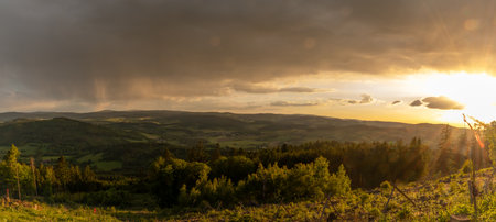 Spring sunset color fresh view from hill Svatobor near town Susice in south west Bohemia in eveningの写真素材