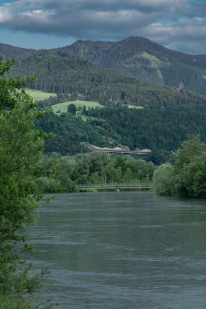 Salzach river with blue water in cloudy summer hot day near Pfarrwerfenの写真素材