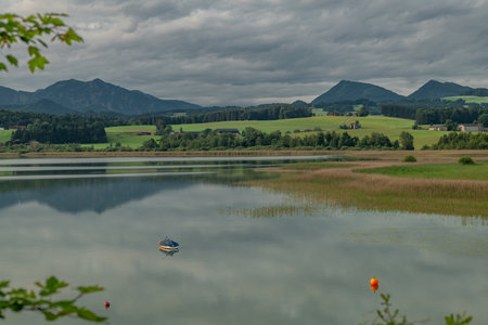 Cloudy color morning sunrise with water of lake Wallersee Austriaの写真素材