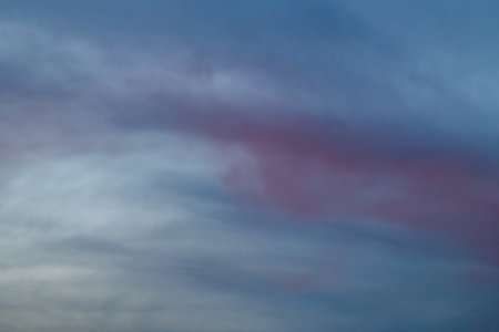 Light and dark blue windy sunset cloudy heaven sky colorの写真素材