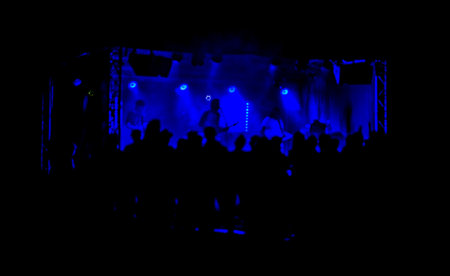 Dark black blue silhouette people concert music color stageの写真素材