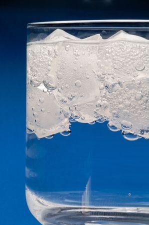 Floating ice in water drink vertical