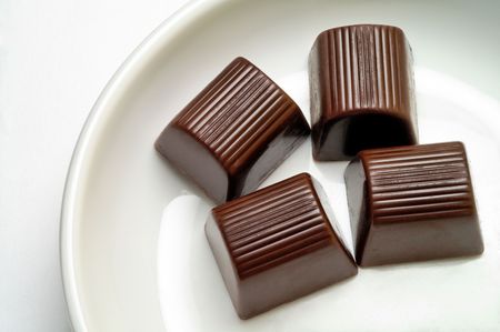 Chocolate candies in a dishの写真素材