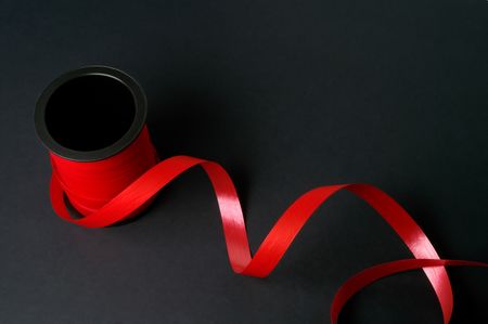 Red tape on black backgroundの写真素材