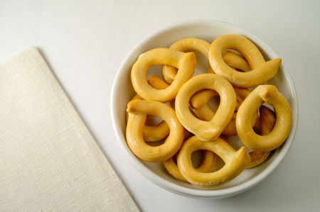 Salted baked pastry and linen napkinの写真素材