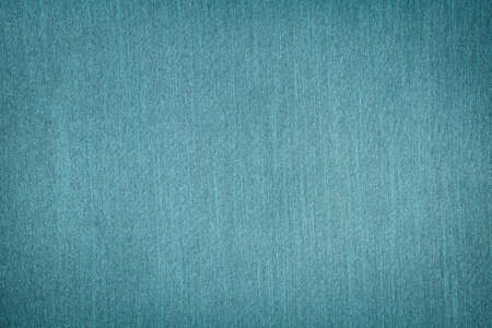 background of textured aquamarine fabric with vignette