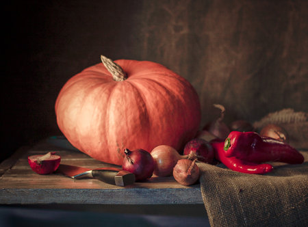 vegan still life of pumpkin, onion and red sweet paprikaの写真素材