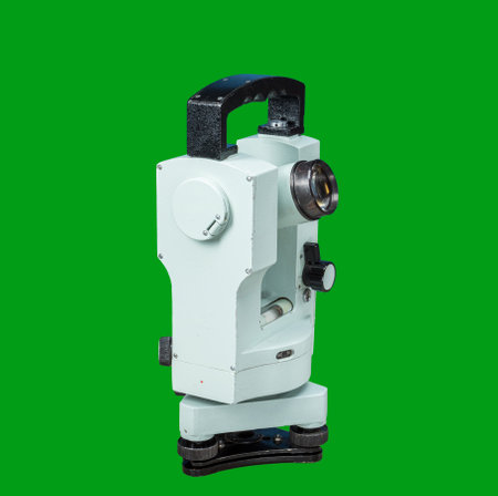 old theodolite 60s from Russia isolate on green backgroundの写真素材