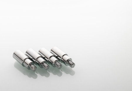 threaded metal tips for light stands with reflection in glass