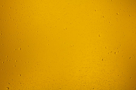 Glowing orange transparent background with contrasting water dropsの写真素材