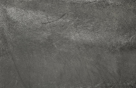 Texture of old black leather with signs of wearの写真素材