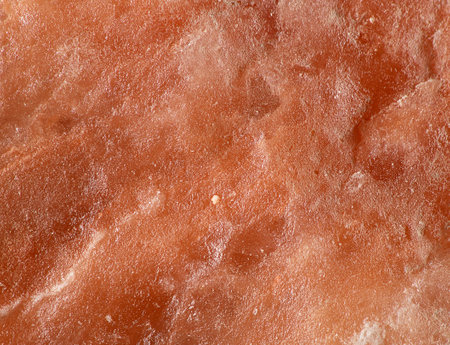 Bright surface texture of Himalayan salt block macro shotの写真素材
