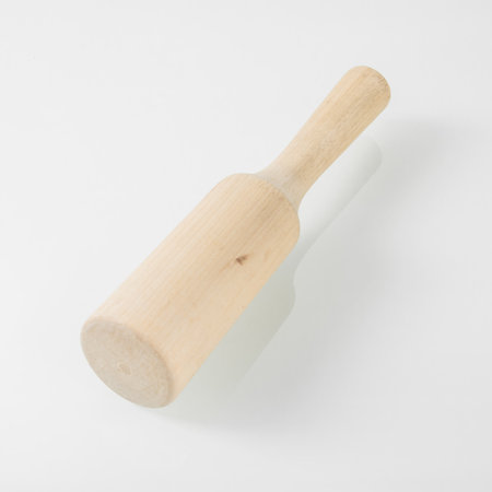 Wooden kitchen utensils. Wooden pestle for puree on a white backgroundの写真素材