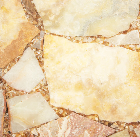Bright stone background from pressed fragments of pink and white marbleの写真素材