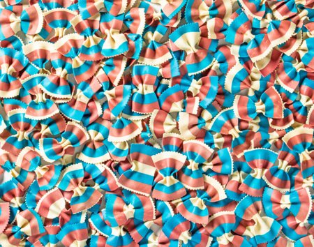 Pattern of bright tricolor pasta in the form of bows close-upの写真素材