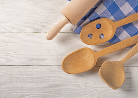 Top View of Wooden Kitchen Accessories and Towel on Natural Board Backgroundの写真素材