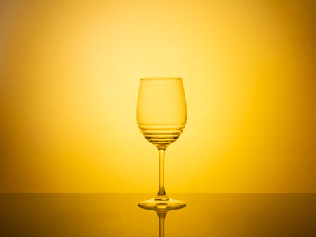 A creative composition of glassware photography featuring colorful gel filters and backlighting, resulting in a vibrant and visually captivating image.の写真素材