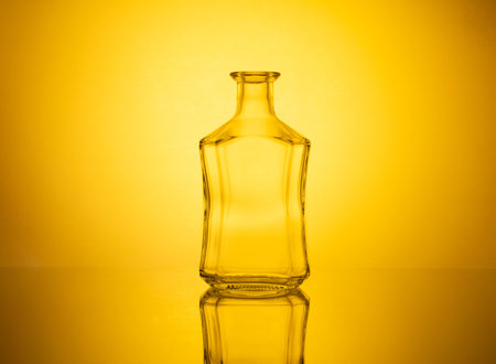 An elegant glassware showcase featuring a variety of beautiful glassware items beautifully illuminated with mesmerizing colored lighting effects, creating a captivating and enchanting atmosphere.の写真素材