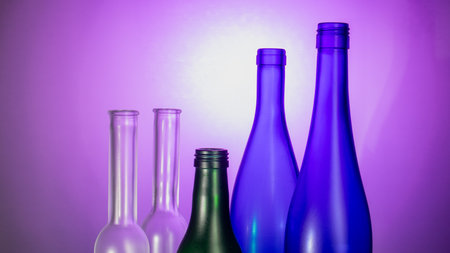 A captivating scene featuring elegant glassware beautifully illuminated by soft backlight, enhanced by helium filters, creating a mesmerizing, luxurious ambiance.の写真素材