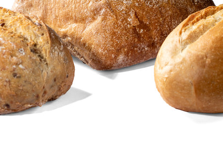 Three loaves of bread on a white background.