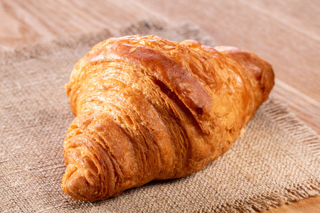 Croissant on the kitchen table, top view, close-up.の写真素材