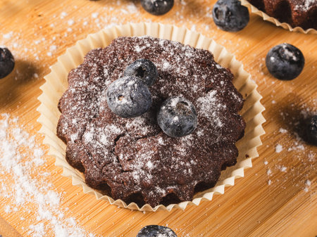 Blueberry muffin on kitchen table, top view, extreme close up.の写真素材