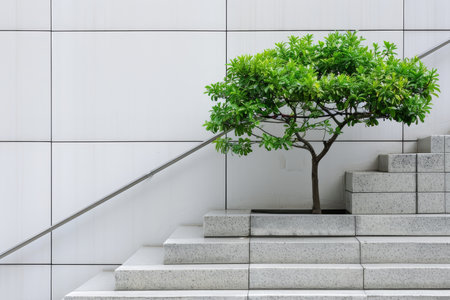 Contemporary Urban Architecture with Green Tree, Symbolizing Growth and Future Development Potentialの素材