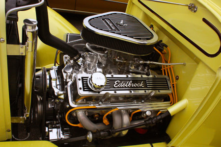 Toronto, Canada, June 5, 2010, Close up of the chromed engine of a yellow classic car at the Street...